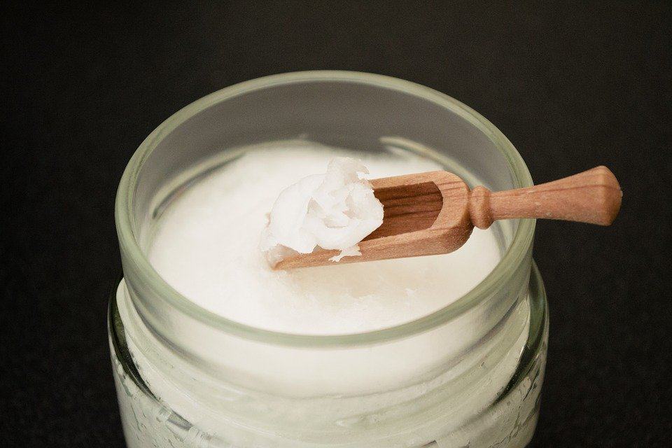 coconut oil on wooden spoon