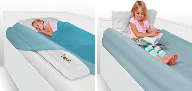 padded toddler bed rail bumper sits under the sheets