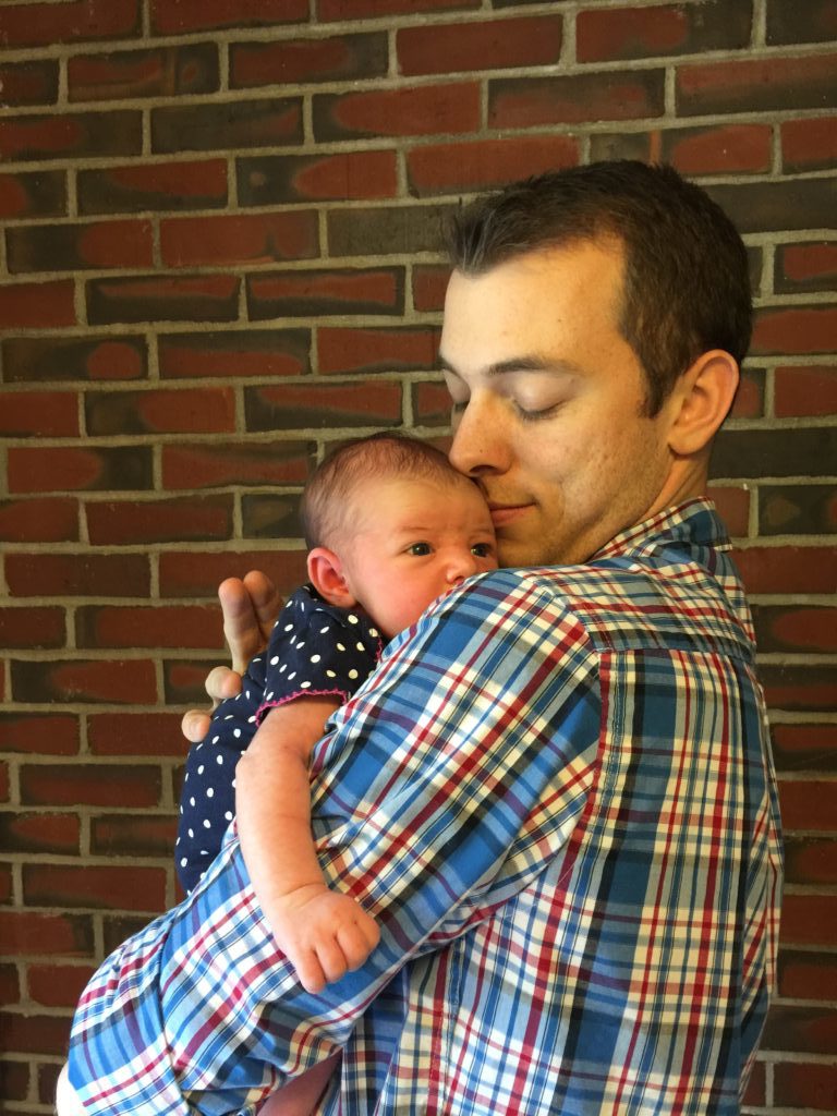 dad bonds with newborn
