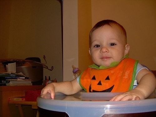 baby orange and green bib