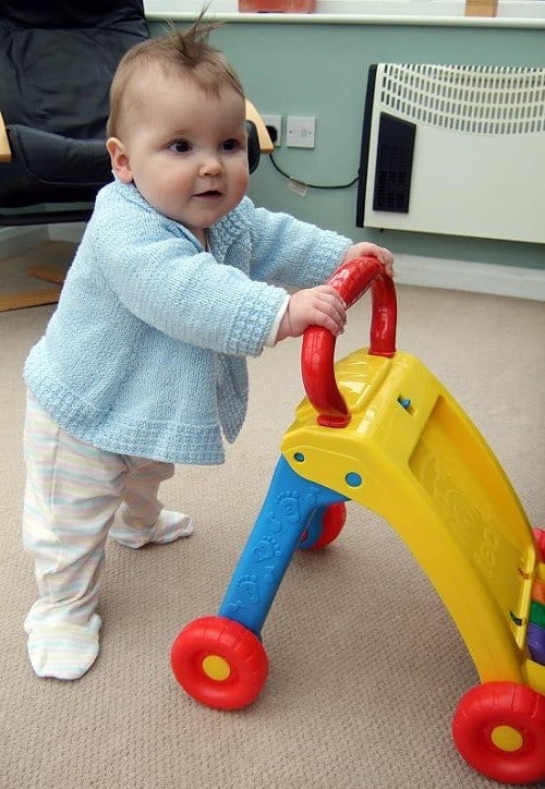 baby standing with walker