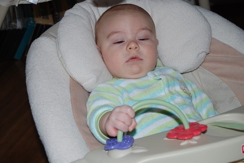 baby lying on swing