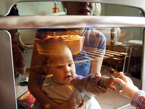 Baby touch a microwave