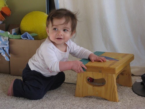 baby holding step tool
