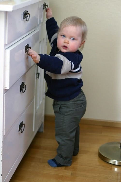 baby attempt to open the drawer