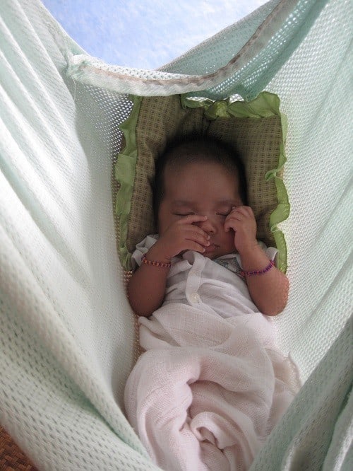 baby sleep in green hammock