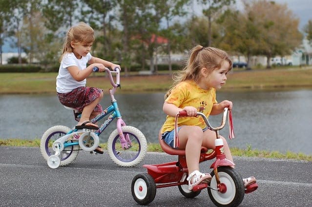 two girls riding their bikes