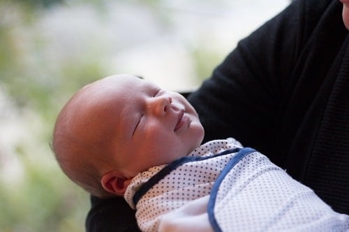 Baby fitted in swaddle wrap