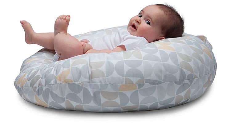 Baby in infant lounger side photo