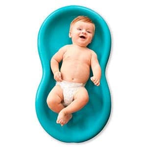 baby laying in a keeper diaper change pad