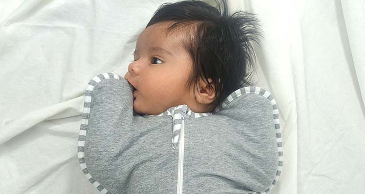 Baby self soothing in love to dream swaddle