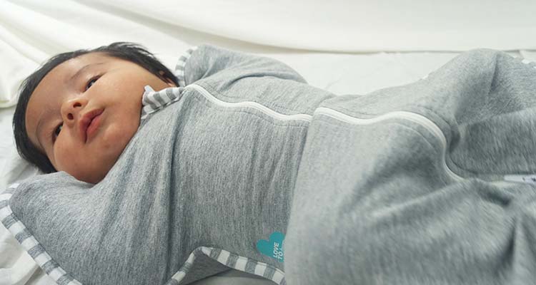 Baby sleeping in love to dream swaddle up