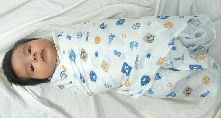 Baby swaddled in summer infant swaddleme baby blanket