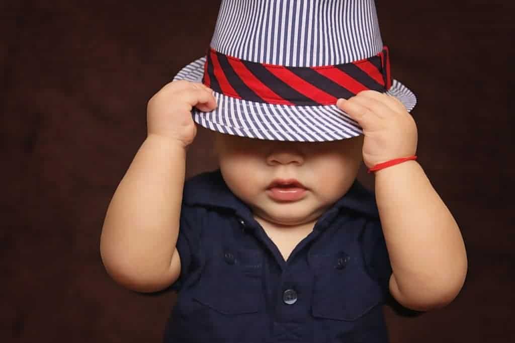 Baby wearing fedora hat