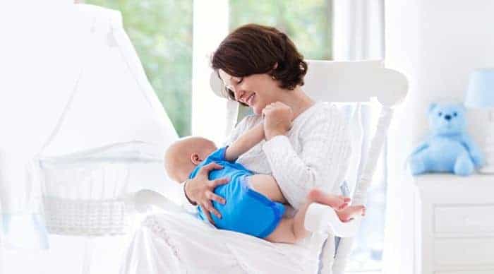 mother playing with her child in preparation of breastfeeding