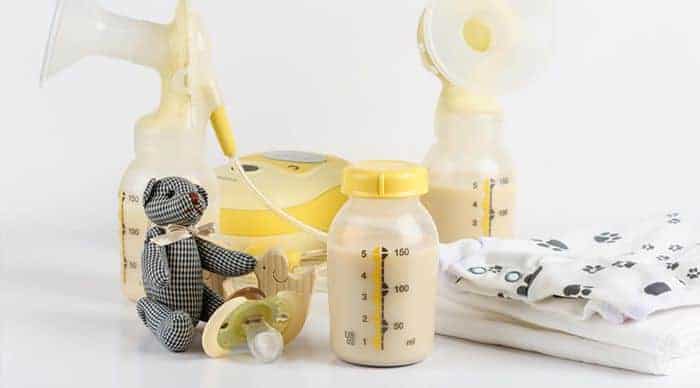 nursing pads with toddler toy and feed