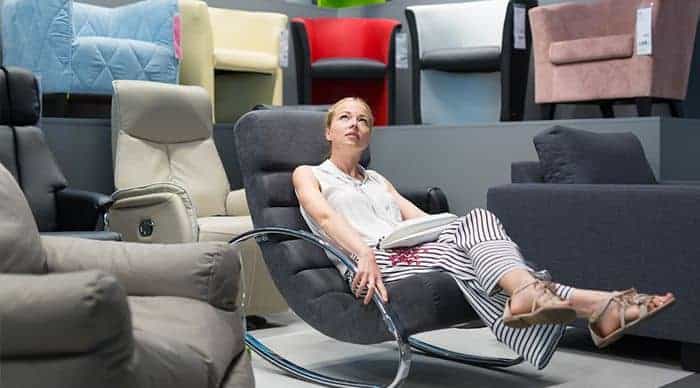 parent sitting on nursing glider