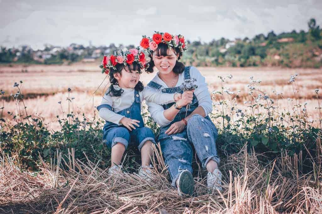 Mother and daughter having fun in the fields