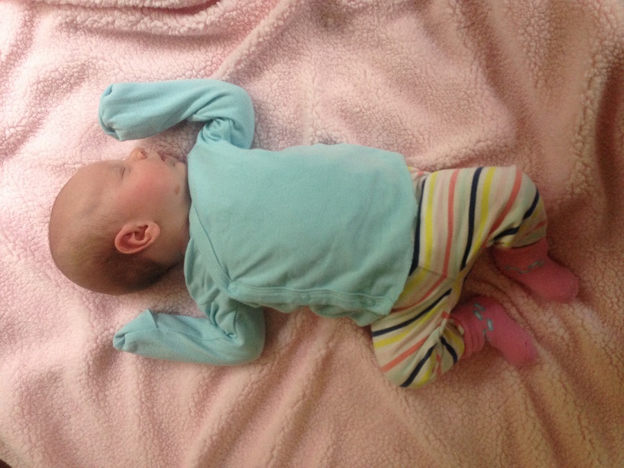 N in newborn clothes