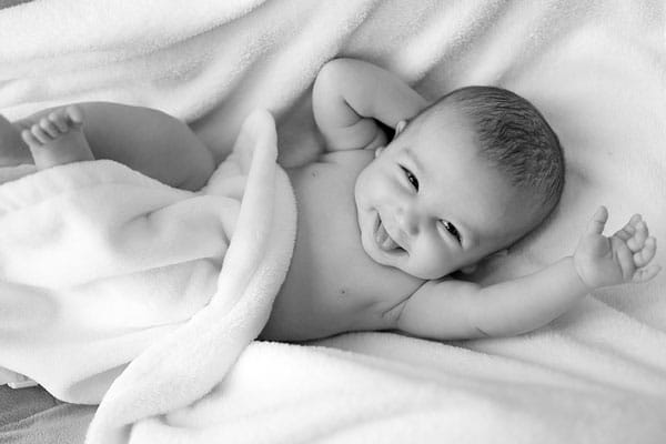 a baby very happy with the blanket