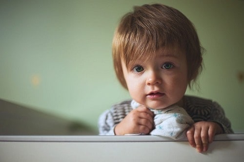 baby holding a towel