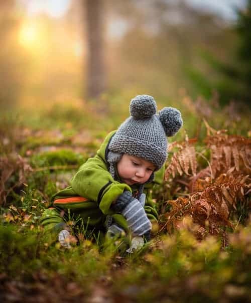 baby wearing gray safety helmet