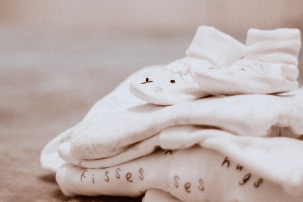 pile of baby blanket and socks