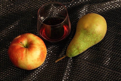 Apple and pear with the glass