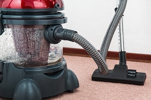 Black and red canister vacuum