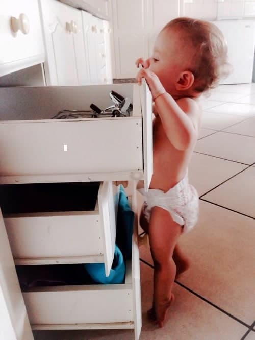 baby wearing diaper check the drawer