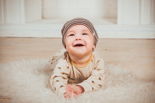The baby is smiling