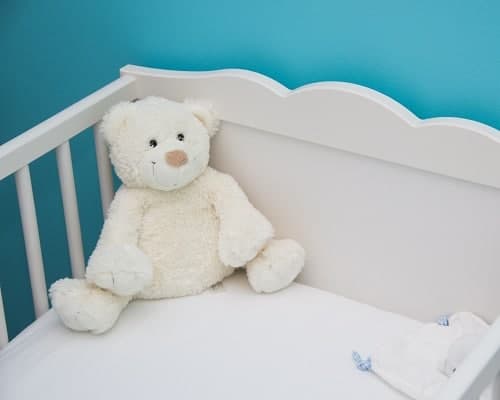 baby crib with white bear