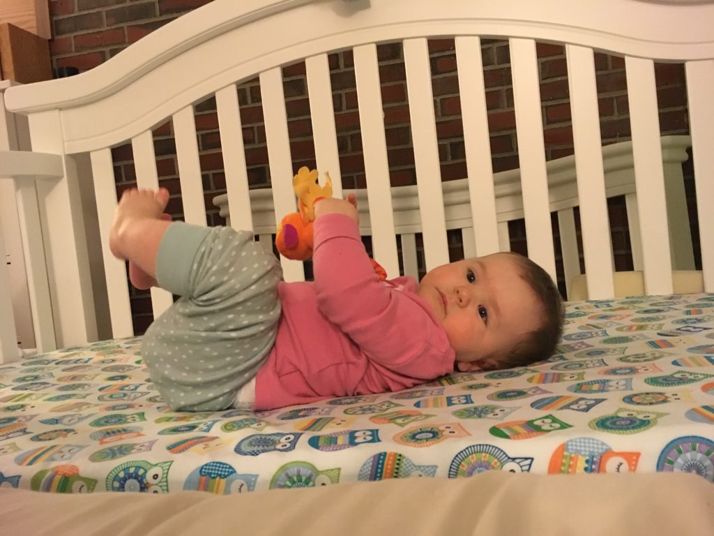 baby registry items_crib up against bed