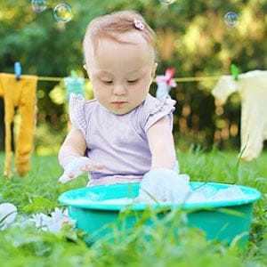 baby washing her own clothes