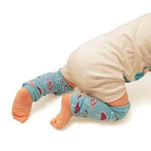 baby wearing leg warmers while crawling