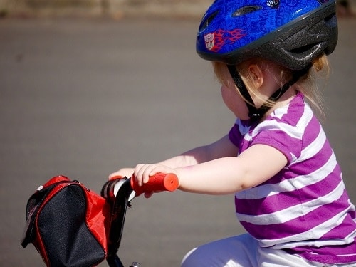 Girl wearing blue bike helmet