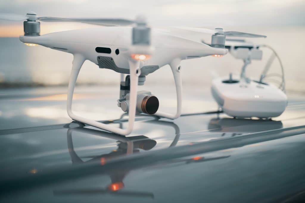 white drone and controller
