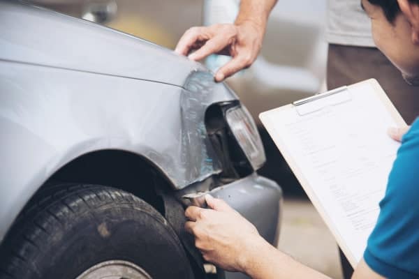 insurance agent working during site car accident claim process