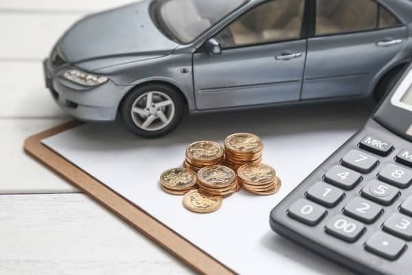 car model calculator coins white table