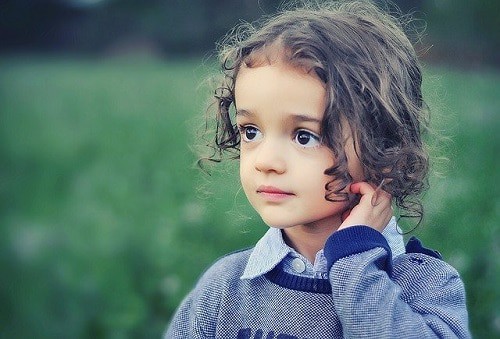 Girl curly hair wearing a jacket