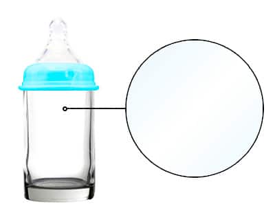 close up of a baby bottle made from glass