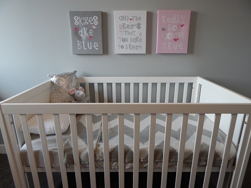 babies crib with stuff toys inside
