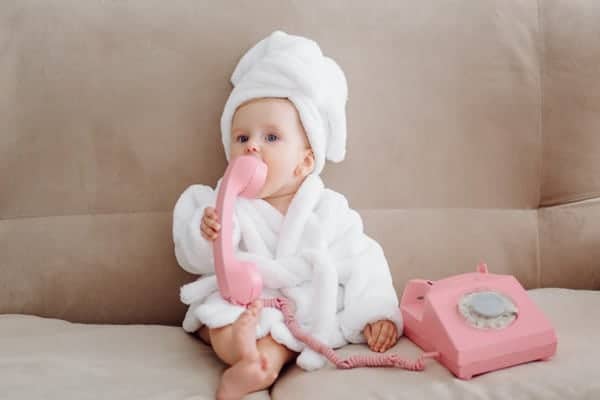 Cute Baby girl in white bathrobe
