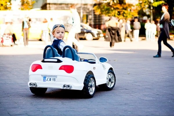 Cute little boy drives his first car