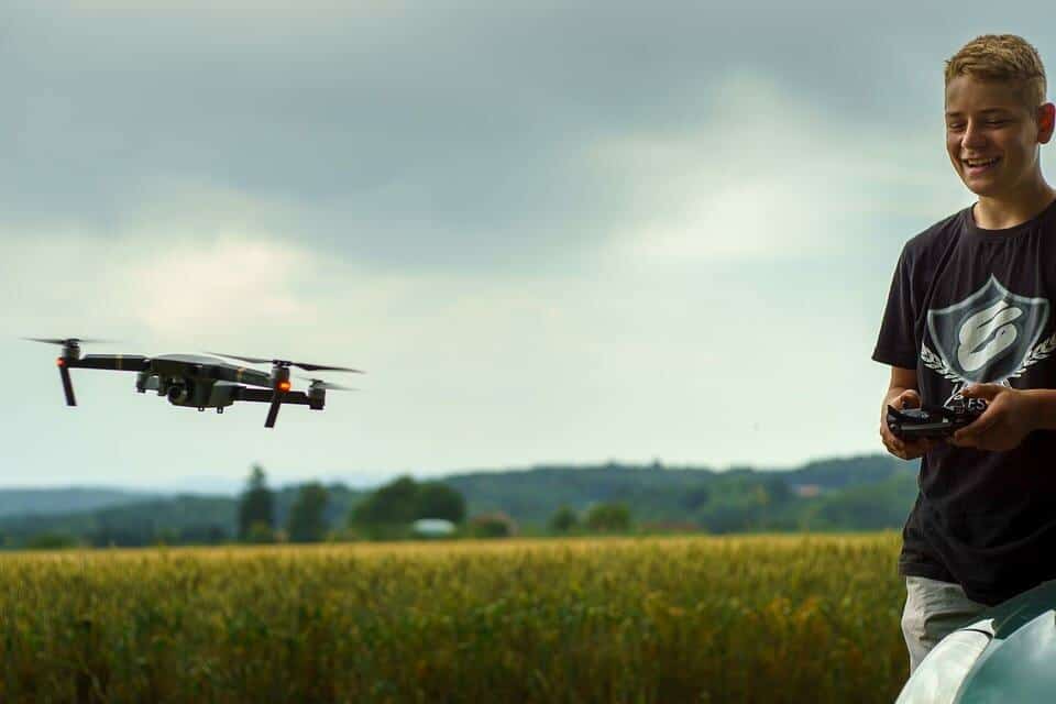 boy playing with a drone