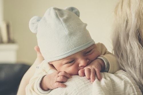 Woman carrying baby