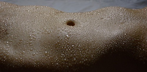 sweat in stomach