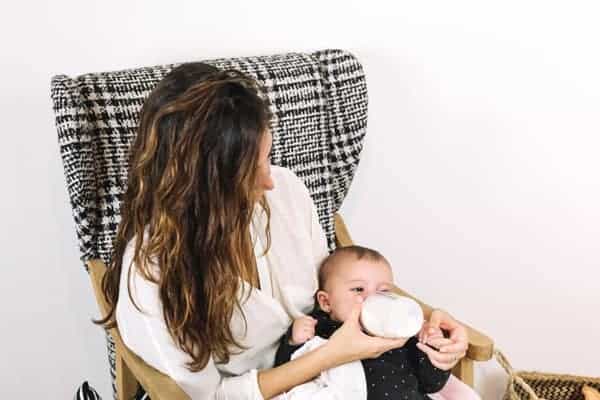 Woman Bottle Feeding