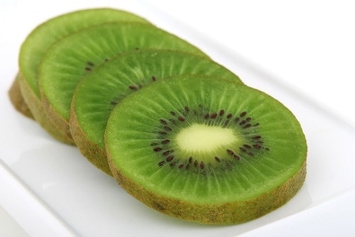 Sliced of Kiwi in a white tray