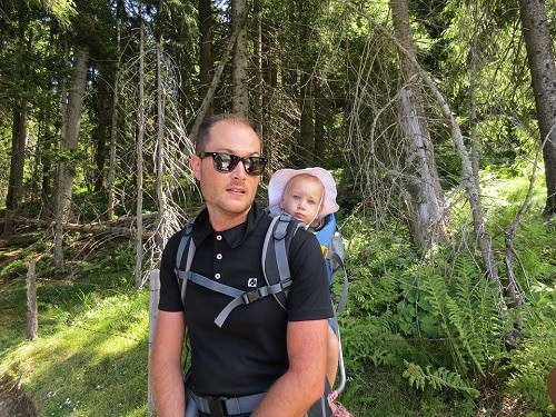 man and baby in the forest